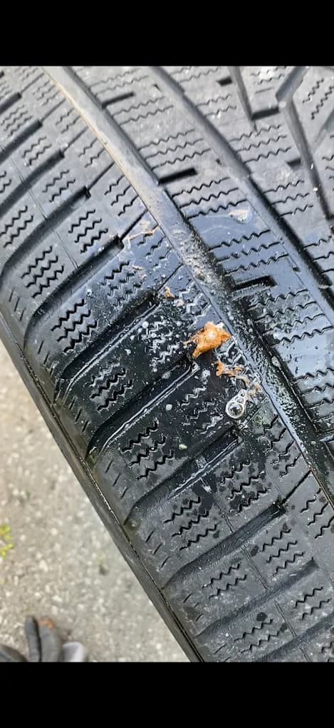 Punctured winter tire, the kind of flat tire GoldenNorth replaces on the spot