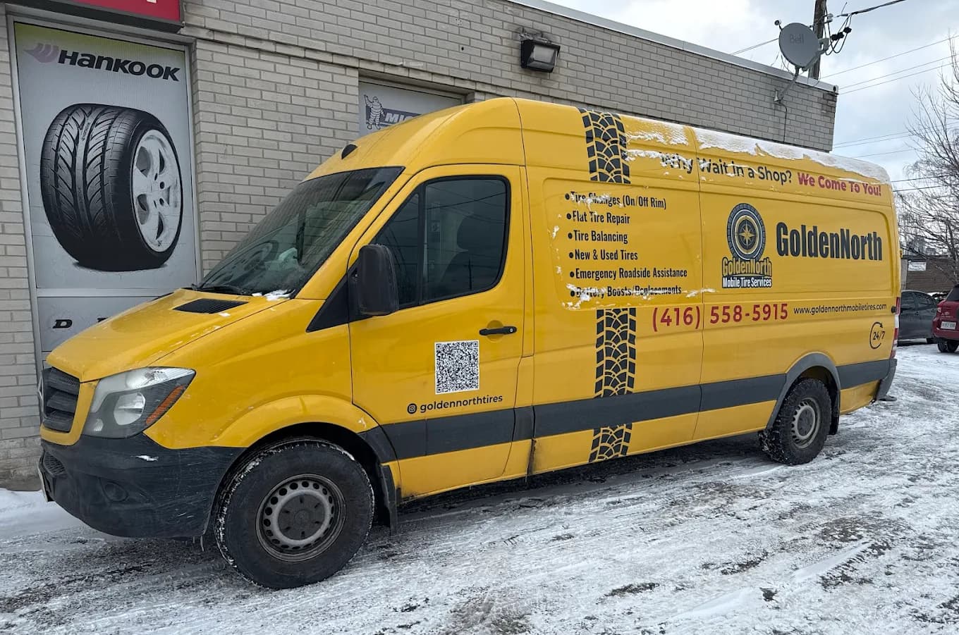 The branded yellow GoldenNorth van in winter